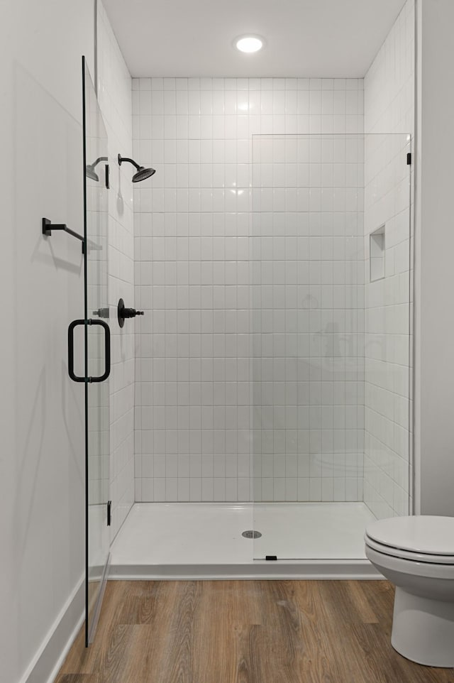 718 N Dupont Ave, Madison, TN 37115 - bathroom featuring toilet, a shower stall, wood finished floors, and recessed lighting