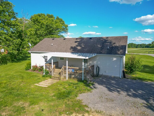 783 Galen Rd, Lafayette, TN 37083 - rear view of property featuring a wooden deck, a lawn, and a shingled roof