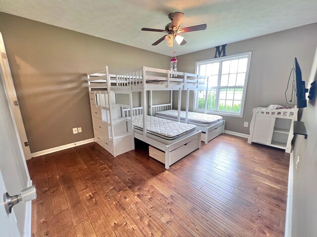 783 Galen Rd, Lafayette, TN 37083 - bedroom with hardwood / wood-style floors, baseboards, and a textured ceiling