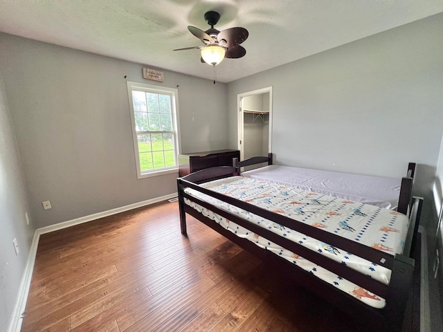 783 Galen Rd, Lafayette, TN 37083 - bedroom featuring hardwood / wood-style flooring, baseboards, ceiling fan, and a spacious closet