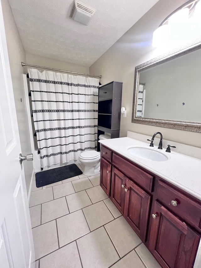 783 Galen Rd, Lafayette, TN 37083 - full bath with tile patterned flooring, vanity, toilet, and a textured ceiling