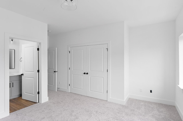 726 N Dupont Ave, Madison, TN 37115 - unfurnished bedroom with carpet, a closet, baseboards, and ensuite bathroom