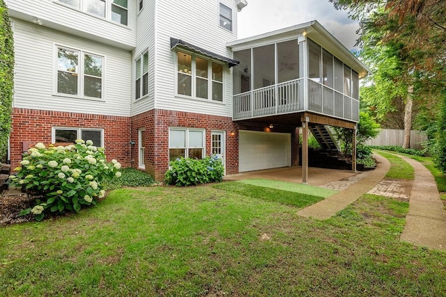 517 Ridgestone Dr, Franklin, TN 37064 - back of house with a sunroom, brick siding, a garage, stairway, and driveway