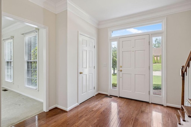 517 Ridgestone Dr, Franklin, TN 37064 - foyer entrance with wood-type flooring, baseboards, crown molding, and stairway