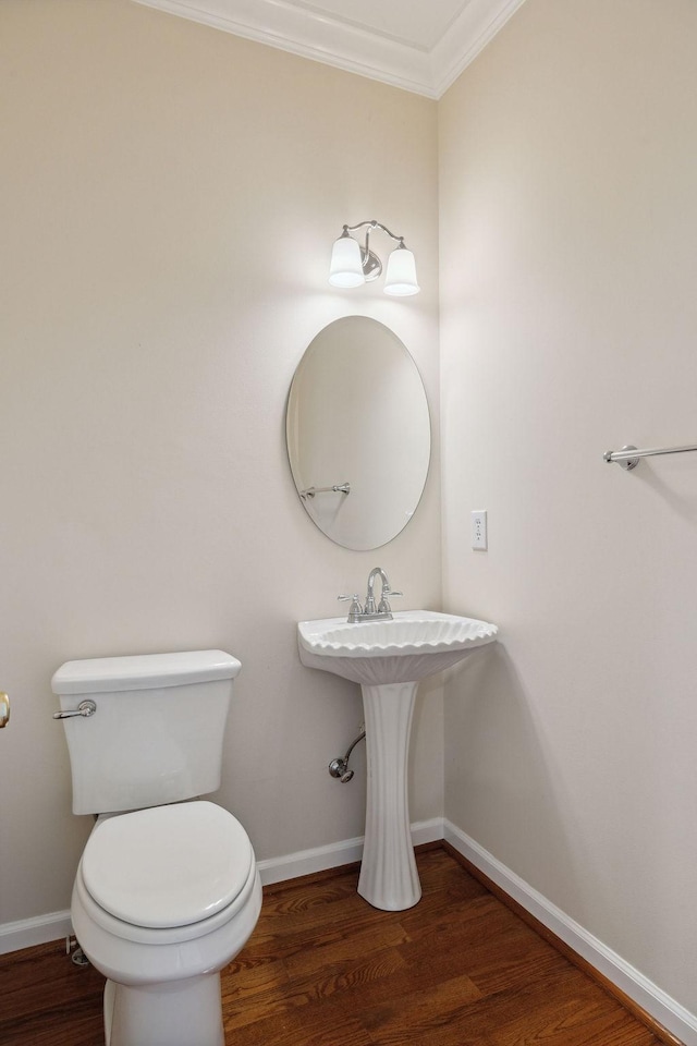 517 Ridgestone Dr, Franklin, TN 37064 - half bathroom with crown molding, toilet, wood finished floors, and baseboards