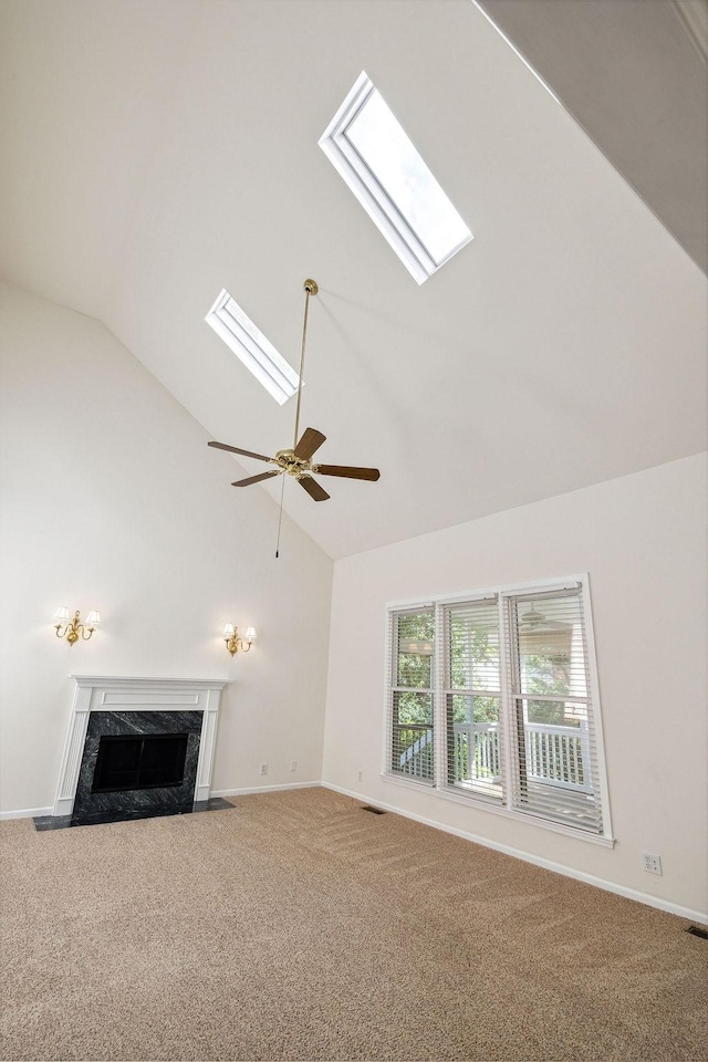 517 Ridgestone Dr, Franklin, TN 37064 - unfurnished living room featuring a skylight, a high end fireplace, carpet floors, baseboards, and high vaulted ceiling