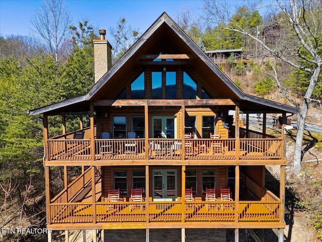 2732 Heather Ln Way, Sevierville, TN 37862 - rear view of property with french doors, a wooden deck, a chimney, and log veneer siding