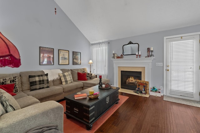 373 Baronswood Dr, Nolensville, TN 37135 - living area featuring dark wood-type flooring, a fireplace with flush hearth, high vaulted ceiling, and healthy amount of natural light