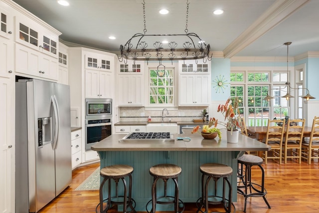 460 Whistler Cv, Franklin, TN 37067 - kitchen with appliances with stainless steel finishes, a sink, crown molding, white cabinetry, and decorative backsplash