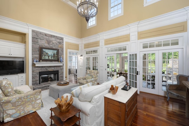 460 Whistler Cv, Franklin, TN 37067 - living area featuring a towering ceiling, french doors, a fireplace, dark wood finished floors, and a chandelier