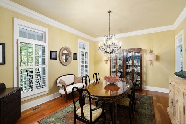 460 Whistler Cv, Franklin, TN 37067 - dining area with dark wood-type flooring, a chandelier, ornamental molding, and baseboards