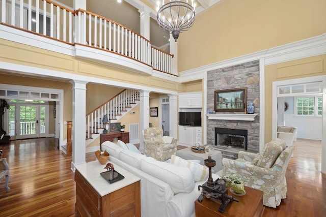 460 Whistler Cv, Franklin, TN 37067 - living area with wood finished floors, plenty of natural light, a towering ceiling, and a fireplace