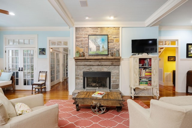 460 Whistler Cv, Franklin, TN 37067 - living area featuring french doors, ornamental molding, wood finished floors, a fireplace, and wainscoting