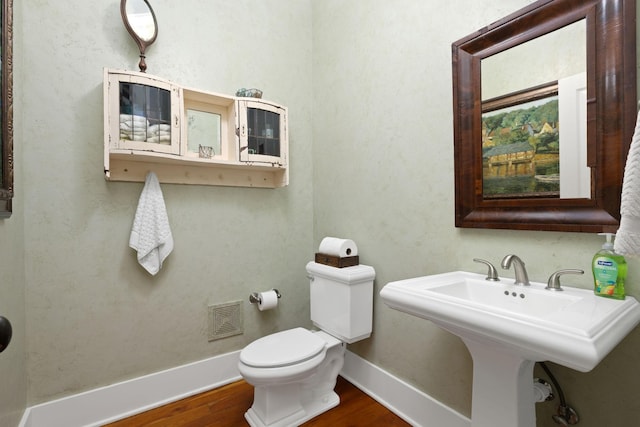 460 Whistler Cv, Franklin, TN 37067 - half bath featuring wood finished floors, toilet, and baseboards
