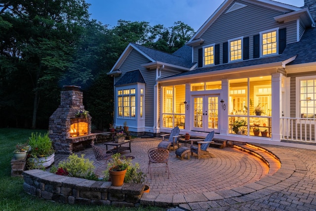 460 Whistler Cv, Franklin, TN 37067 - back of property featuring an outdoor stone fireplace, a patio area, a shingled roof, and french doors