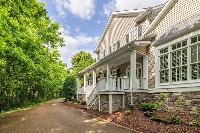 460 Whistler Cv, Franklin, TN 37067 - view of home's exterior with covered porch, stairway, ceiling fan, and concrete driveway