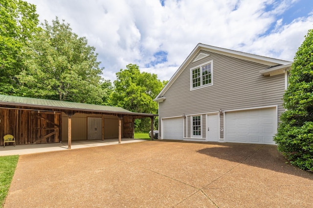 460 Whistler Cv, Franklin, TN 37067 - view of side of home with a garage and an exterior structure
