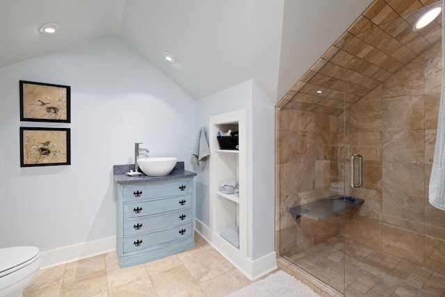 460 Whistler Cv, Franklin, TN 37067 - bathroom featuring vaulted ceiling, a stall shower, vanity, toilet, and baseboards