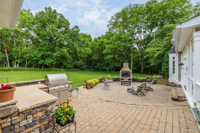460 Whistler Cv, Franklin, TN 37067 - view of patio with a fireplace and view of scattered trees