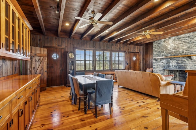 4430 Brush Hill Rd, Nashville, TN 37216 - dining room featuring wooden ceiling with exposed beams, ceiling fan, wood walls, and light wood-type flooring