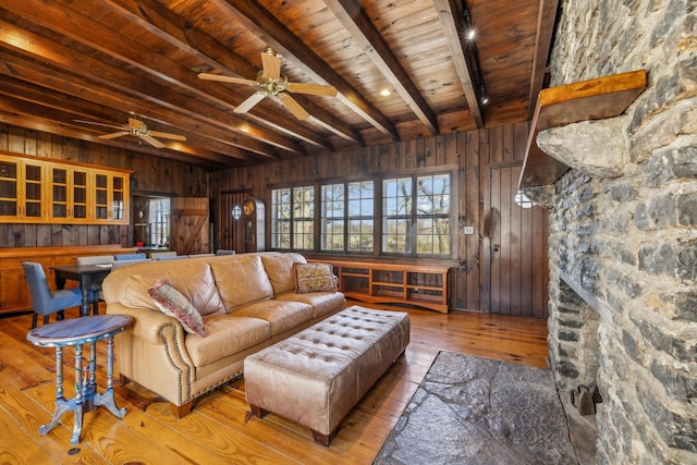 4430 Brush Hill Rd, Nashville, TN 37216 - living room featuring wooden walls, wood ceiling with exposed beams, a ceiling fan, and wood-type flooring