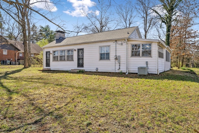 4430 Brush Hill Rd, Nashville, TN 37216 - view of front of house featuring a chimney, a front lawn, and central AC unit