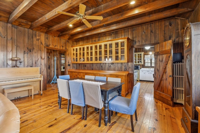 4430 Brush Hill Rd, Nashville, TN 37216 - dining room featuring wooden walls, wood ceiling with exposed beams, light wood finished floors, and a ceiling fan