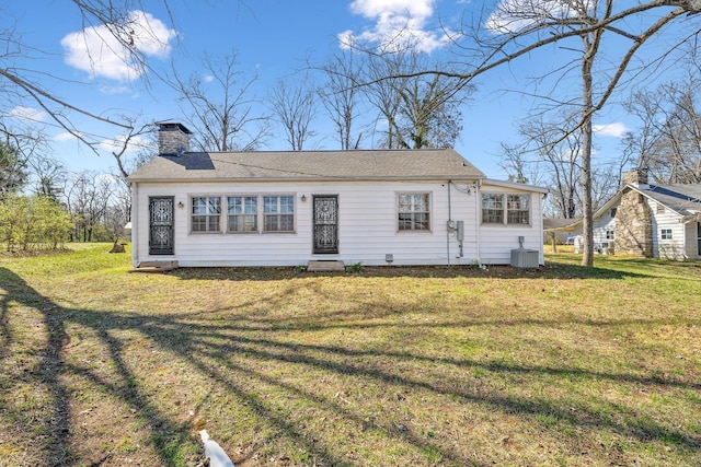 4430 Brush Hill Rd, Nashville, TN 37216 - view of front facade with a front yard, a chimney, and cooling unit
