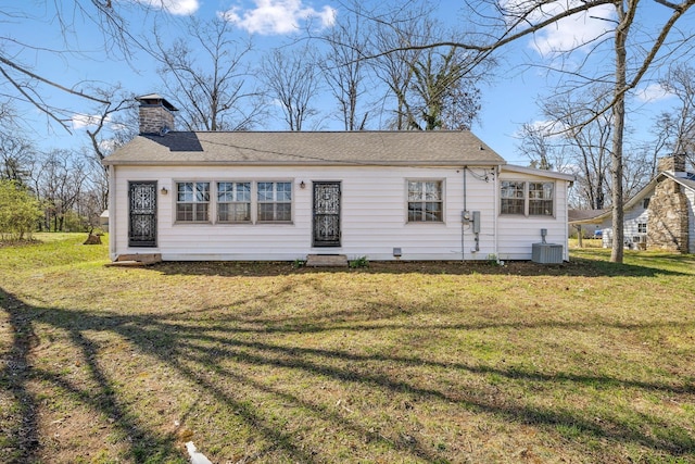 4430 Brush Hill Rd, Nashville, TN 37216 - rear view of house with a chimney, a lawn, and cooling unit