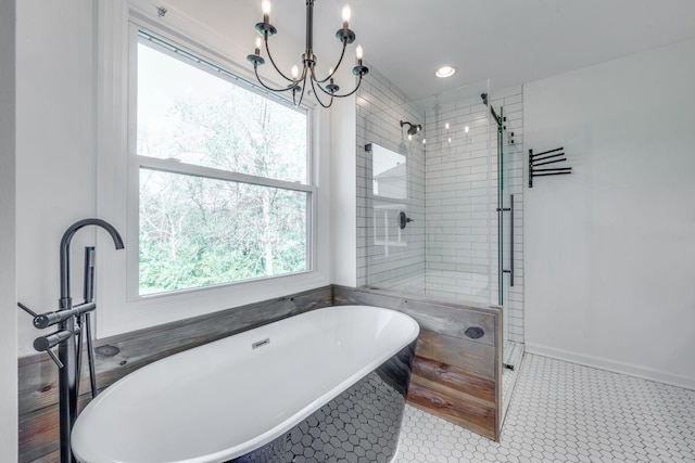 608 Claridge Ct, Franklin, TN 37064 - full bathroom with plenty of natural light, a freestanding tub, a stall shower, and a chandelier