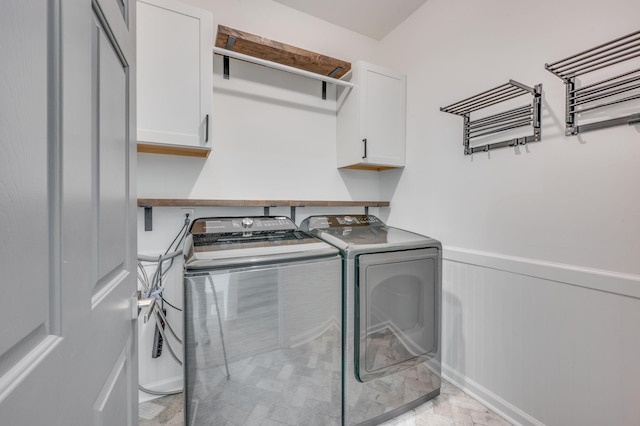 608 Claridge Ct, Franklin, TN 37064 - laundry room with washer and clothes dryer, cabinet space, a wainscoted wall, and a decorative wall