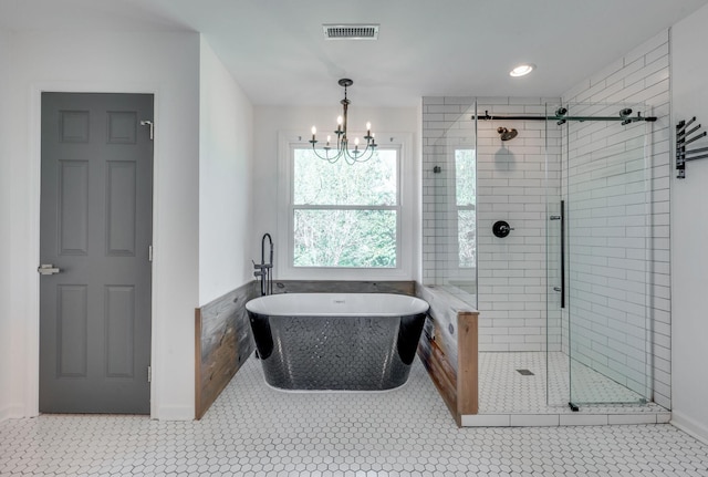 608 Claridge Ct, Franklin, TN 37064 - bathroom featuring a stall shower, a soaking tub, and a chandelier