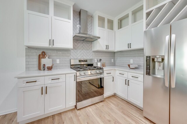 608 Claridge Ct, Franklin, TN 37064 - kitchen featuring stainless steel appliances, wall chimney range hood, light countertops, and tasteful backsplash