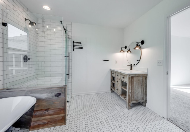 608 Claridge Ct, Franklin, TN 37064 - bathroom featuring a shower stall, a soaking tub, vanity, baseboards, and recessed lighting
