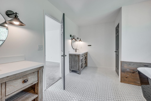 608 Claridge Ct, Franklin, TN 37064 - full bathroom with a freestanding tub, vanity, and baseboards
