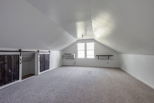 608 Claridge Ct, Franklin, TN 37064 - additional living space featuring an AC wall unit, lofted ceiling, carpet, and baseboards