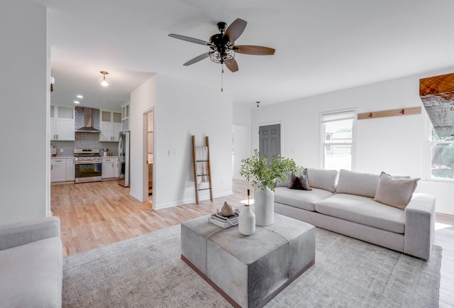 608 Claridge Ct, Franklin, TN 37064 - living area featuring light wood-style floors, a ceiling fan, and baseboards