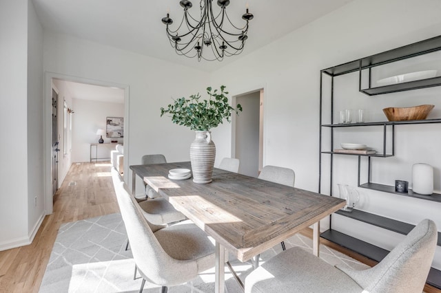 608 Claridge Ct, Franklin, TN 37064 - dining space featuring a chandelier, light wood-style flooring, and baseboards