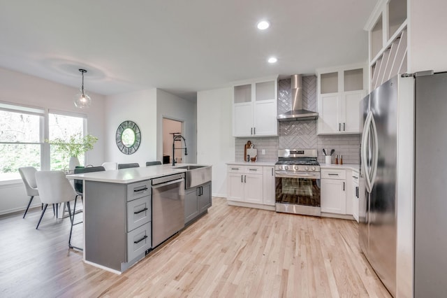 608 Claridge Ct, Franklin, TN 37064 - kitchen with wall chimney exhaust hood, appliances with stainless steel finishes, decorative backsplash, a sink, and light countertops