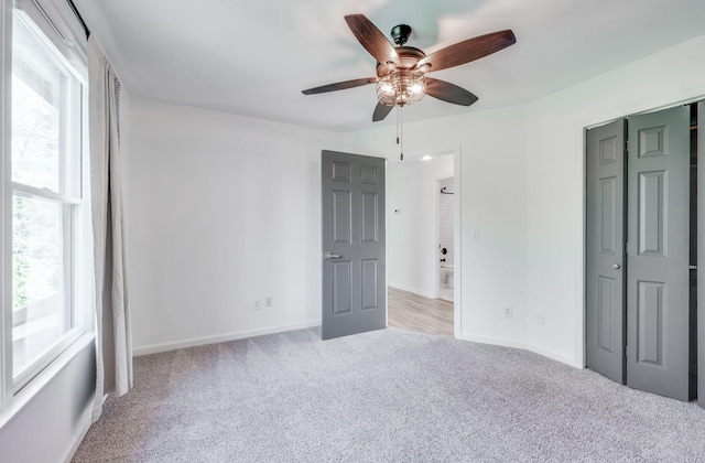 608 Claridge Ct, Franklin, TN 37064 - unfurnished bedroom with carpet floors, multiple windows, baseboards, and ceiling fan