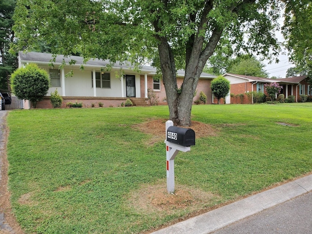 4840 Shasta Dr, Old Hickory, TN 37138 - ranch-style house featuring brick siding, a front lawn, and covered porch