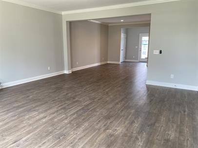 1451 Rebecca Johns Dr, Murfreesboro, TN 37128 - empty room with ornamental molding, dark wood-style flooring, and baseboards