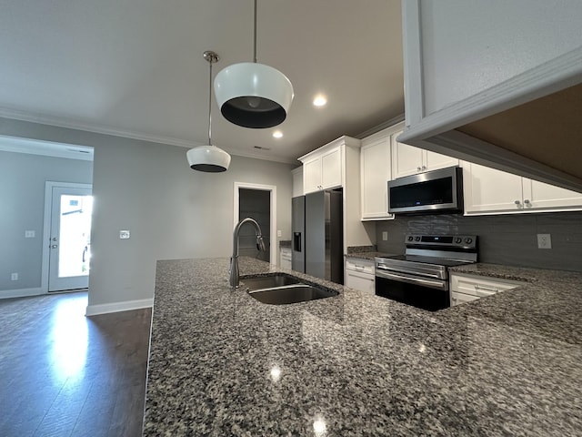 1451 Rebecca Johns Dr, Murfreesboro, TN 37128 - kitchen featuring appliances with stainless steel finishes, a sink, crown molding, dark stone counters, and white cabinets