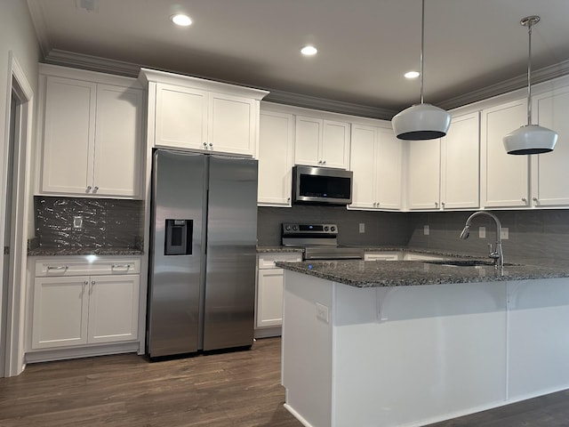 1451 Rebecca Johns Dr, Murfreesboro, TN 37128 - kitchen featuring appliances with stainless steel finishes, a sink, dark stone counters, white cabinetry, and recessed lighting