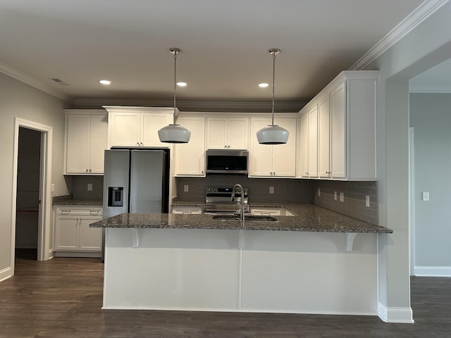 1451 Rebecca Johns Dr, Murfreesboro, TN 37128 - kitchen with appliances with stainless steel finishes, a sink, dark stone counters, ornamental molding, and a peninsula
