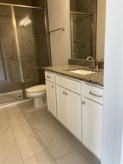 1451 Rebecca Johns Dr, Murfreesboro, TN 37128 - bathroom with vanity, toilet, a shower stall, and marble look tile flooring