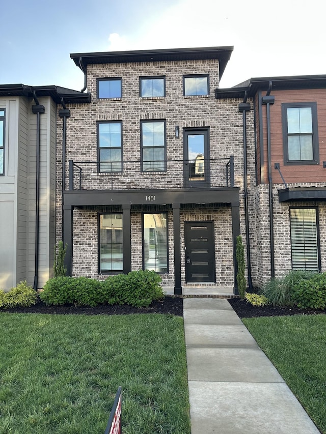 1451 Rebecca Johns Dr, Murfreesboro, TN 37128 - view of front of home with a front yard, brick siding, and a balcony