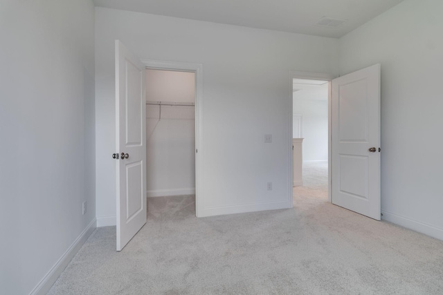 529 Little Penny Dr, Smyrna, TN 37167 - unfurnished bedroom featuring carpet floors, a walk in closet, and a closet