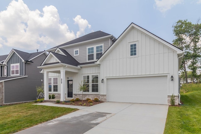 529 Little Penny Dr, Smyrna, TN 37167 - view of front of home featuring board and batten siding, concrete driveway, stone siding, and a front lawn