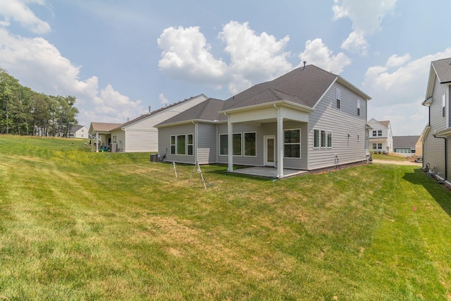 529 Little Penny Dr, Smyrna, TN 37167 - back of house featuring a patio area and a lawn